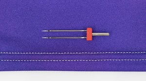 Using the double needle will allow your basic sewing machine to create a professional looking cover stitch that's perfect for hemming. Consult you manual to verify the best way to use a double needle with your sewing machine. | Professor Pincushion