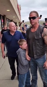 They were yelling “thief” at a shaking twelve-year-old when a biker grabbed his sleeve—and suddenly the crowd decided the biker was the real danger. It happened outside a small strip mall in America, late afternoon, heat still clinging to the concrete. A boy stood at the center of a tightening circle. Too young to look brave. Backpack twisted in his hands. Eyes darting, desperate. Adults shouted over each other. “He took it.” “We saw him.” “Empty your pockets.” Phones were already recording. No 