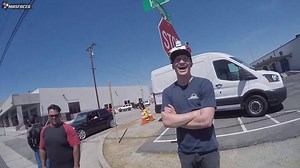 Aerial footage captures motorcycle wheelie performance from unique overhead perspective