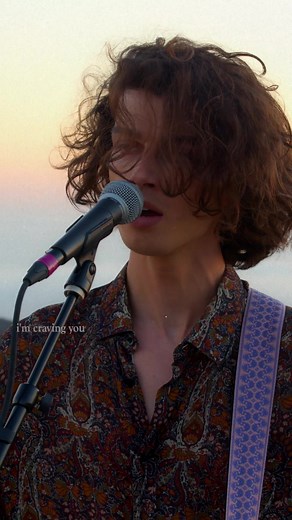 Curly Haired Singer Shares Emotional Sunset Performance