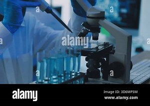 laboratory assistant working with microscope