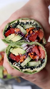These Vegan Wraps are easy to assemble, ready in less than 15 minutes, and taste incredible! Hearty and healthy, vegan lettuce wraps are the perfect plant-based, no-cook lunch or dinner! Ingredients 2 tortilla wraps, mine are a spinach flavor 3 tablespoons of guacamole OR half an avocado cut into long strips 3 tablespoon of hummus 1 carrot shredded Handful of chopped red onion Handful of leafy greens 1/4 of a medium tomato, chopped 1/4 of a red bell pepper (any color works but I love the sweeter