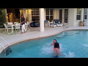 Jumping in pool with clothes on