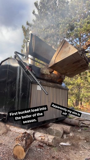 Loading the log boiler with the machine almost feels like cheating. #woodheat #homestead #selfreliance #woodboiler