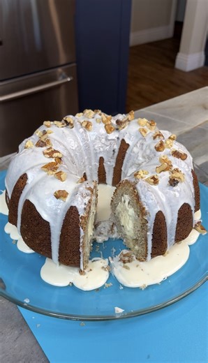 Easy Spring Dessert Marty M makes a super easy stuffed banana bread bundt cake filled with delicious cheesecake and topped with a cream cheese icing. So good! Enjoy y'all! | Marty M