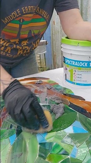 Grouting with Laticrete Spectralock 1 premixed epoxy grout.