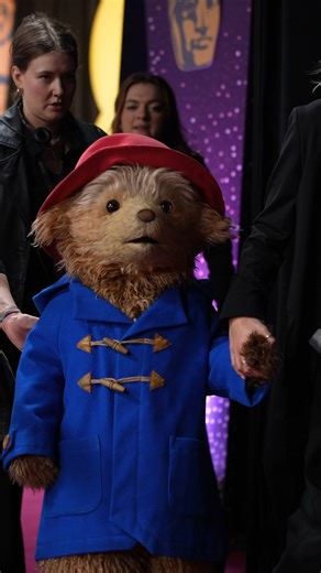 A very British red carpet moment. Paddington Bear attends the British Academy Film Awards (@bafta), duffle coat, red hat, manners and all. #Bafta #Bafta2026 #PaddingtonBear Video credit: Getty | Rolling Stone AU/NZ