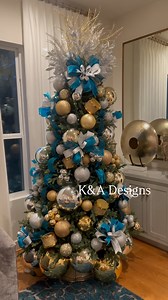 Tree #64 is this gold, silver, & teal beauty filled with handmade bows & shiny baubles! 🎄✨🎄✨🎄 . . . . . #christmaswreath #christmaswreaths #christmasgarland #wreath #christmasdecorideas #glamchristmaswreath #christmastree #christmastrees #centerpiecesideas #christmascenterpiece #christmastablescape #christmastreedesigner #christmastreedecorating #christmastreedecorations #christmastreedecoration #christmastreedecor #glamchristmasdecor #luxuryholidayhome #glamchristmas #holidayhomedecor #holid