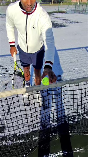Kids Having Fun Playing Tennis in the Snow
