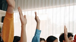 Group of interviewee candidate in colorful casual wearing line up for vacancy interview sitting on the chair. Intern raise hand. Job opportunity recruitment for HR agency and vacancy concept. Synergic