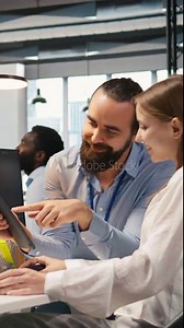 Vertical video Mentor teaching young employee to troubleshoot software errors using AI. Manager doing induction to newcomer junior dev using computer to write code, developing machine learning APIs