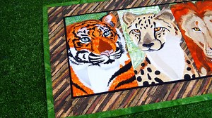 Big Cats Table Runner 5x7 6x10 7x12 https://swpea.com/products/big-cats-table-runner-5x7-6x10-7x12 The Big Cats Table Runner is an appliqué and embroidery table runner design made in the 5x7, 6x10 or 7x12 hoops. This is a machine embroidery design. There is a Sweet Pea Incredi-thread colour chart provided with this design if you want to replicate our thread colours for the cats. There are 5 different blocks in this table runner and they are then joined with the sewing machine. Cheetah | Lion | P