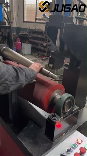 This is a plate rolling machine used for producing motorcycle mufflers.