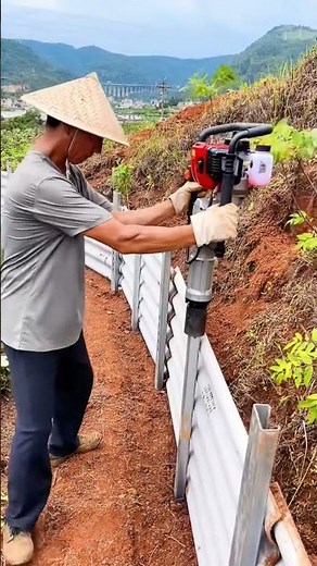 Hillside Erosion Control: Installing Metal Retaining Barriers! #shorts