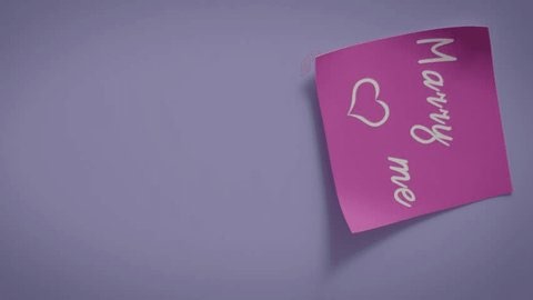 clip-4051942649-cozy-handwritten-note-reading-“marry-me”-rests