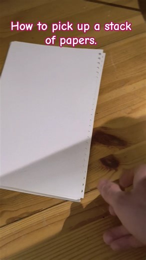 How to pick up a stack of papers.