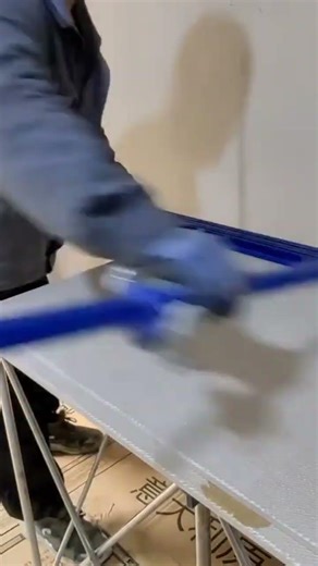 cutting large tiles with a long rail guide cutter tool for precise size in home interior project