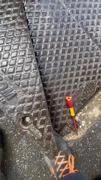 How to Safely Open a Drainage Cover Outdoors