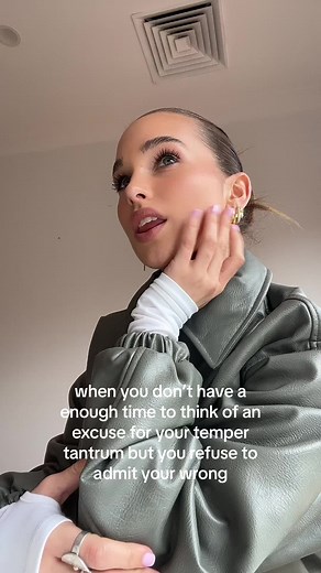 Expressing Frustration Through Gestures in A Green Jacket