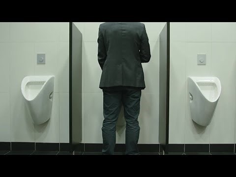 Man Peeing In Urinal In Restroom Stock Video