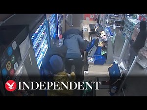 Gang of balaclava-clad men armed with crowbars steal more than £3,000 from Surrey Co-op