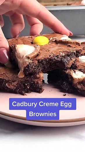 Super fudgy Cadbury Creme Egg Brownies for Easter! #easterbrownies #easter2023 #eastertreats https://www.emilyenchanted.com/creme-egg-brownies/