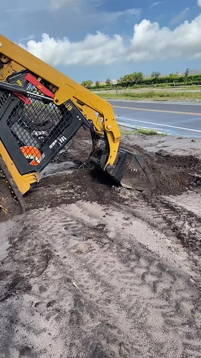 CAT Skid Steer Loader in Action: Mud Excavation
