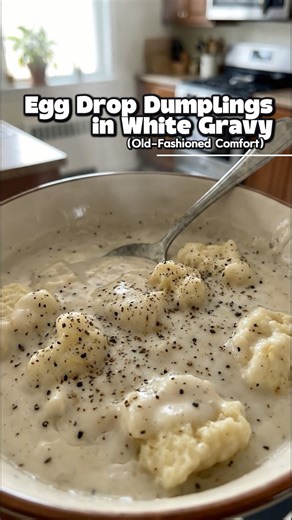 🥣 Egg Drop Dumplings in White Gravy (Old-School Comfort • Soft & Pillowy • Grandma-Style Cozy) This is pure old-fashioned comfort food — tender egg-drop dumplings cooked right in a thick, peppery white gravy. No meat, no extras, just flour, eggs, milk, and patience. Soft dumplings, creamy gravy, and that spoon-coating texture that feels like home from the first bite. Simple food. Deep comfort. Timeless 🤍 ⏱️ Recipe Details Prep Time: 10 minutes Cook Time: 20 minutes Total Time: 30 minutes Servi