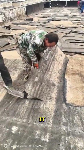 Rooftop Repair: Peeling Damaged Tar Layers.
