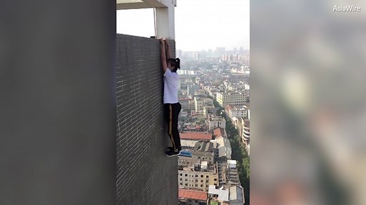 Daredevil performing EXTREME stunts over China's skyscrapers