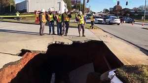 20K views · 128 reactions | Here’s a closer look at the parking lot of the Kangaroo Express gas station at Haywood Road and Airport Road, where a massive sink hole opened at approximately 5 a.m. today, exposing a gas line below. Crews are here making sure pieces of overhanging concrete don’t drop on the gas lines, which could open them up. As soon as the concrete is secured, at least one southbound lane will re-open on Haywood Road. #gvlpd | Greenville Police Department | Facebook