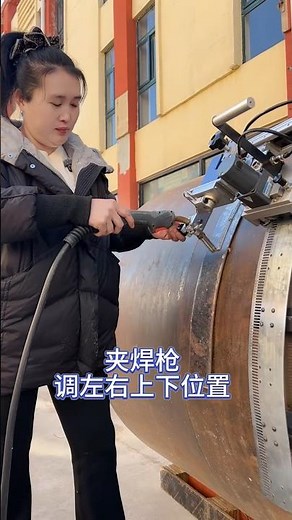 A young woman teaches you step-by-step how to use an automatic welding carriage: