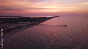 4k drone footage over the Bogue Inlet Pier during sunrise in Emerald Isle, North Carolina.