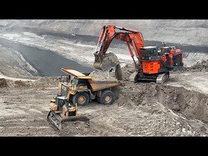 HITACHI ex 2600-6 excavator in action loading Komatsu HD 785-7 Dump truck - Miningstory