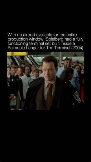 Explaining a Movie on Instagram: "While filming The Terminal (2004) no airport could accommodate the months-long shoot, so Steven Spielberg commissioned a fully functioning terminal set inside a massive hangar at LA/Palmdale Regional Airport. The production built a complete “JFK” interior from the ground up, following real building codes and outfitting it with working escalators, storefronts, lighting, and the sweeping architecture of a modern concourse. It allowed Spielberg to control every hou