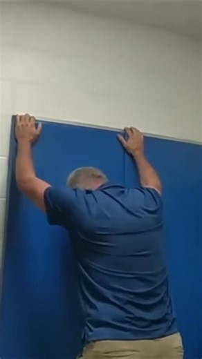 A traveler is asked by airport security to remove shoes and socks for inspection. The agent ensures all items are in one piece before the traveler proceeds. #AirportSecurity #TSA #TravelTips #SecurityCheck #Travel | Equal Justice