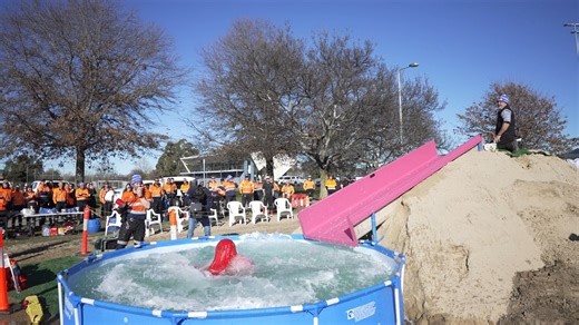 City of Launceston staff used their lunch break today to raise money for the Fight MND Big Freeze. Mayor Mathew Garwood and Acting CEO Shane Eberhardt were among 20 staff members who slid into an icy pool to help raise funds for Motor Neurone Disease at Churchill Park. "Fight MND has a special resonance at the City of Launceston because we've had employees in recent years who have been directly impacted by MND," Mayor Garwood said. "Going down the slide today was just a small gesture to support 