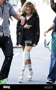 Pop singer Kylie Minogue shoots a new music video in downtown L.A., wearing white platform knee-high boots and a revealing top.  Minogue, 41, has recently denied rumors that she is planning to wed Spanish boyfriend Andres Velencoso Segura, 32, reportedly saying that marriage might not be a path she'll ever go down.  Minogue's eleventh studio album Aphrodite is set to be released this July. Los Angeles, CA. 05/08/10 Stock Photo - Alamy