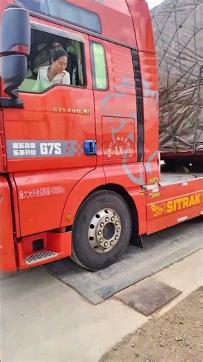 Female truck driver from 90s loads vegetables in Qujing, heads to Guangdong. 1,400 km journey