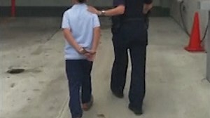 Shocking footage shows 7 year-old led away in handcuffs