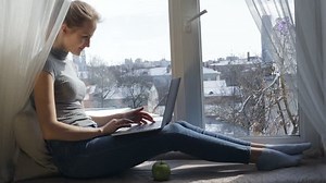 clip-26460704-woman-working-on-her-laptop