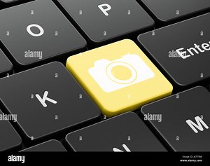 Tourism concept: Photo Camera on computer keyboard background Stock Photo - Alamy