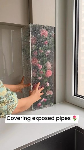 13M views · 78K reactions | Covering exposed pipes can be done in a simple and creative way. For example, gas pipes that were left visible during cabinet installation can later be disguised with decorative touches such as rose vines or stone-grain acrylic. This not only hides the pipes but also adds character to the space, creating a more pleasant atmosphere in the kitchen.#pipecovering #gaspipecovering #pipelinedecoration #DIY | Tiffany Design Studio | Facebook