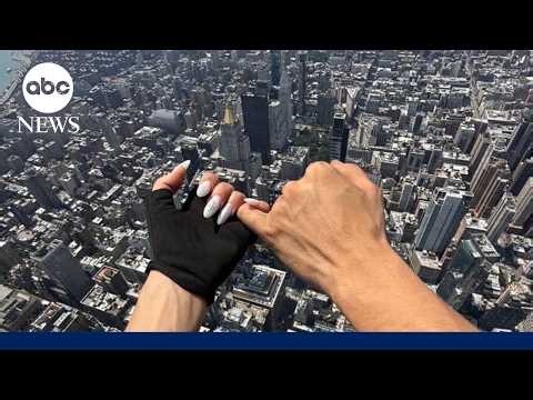 Daredevils climb to top of the Empire State Building, display banner before proposal