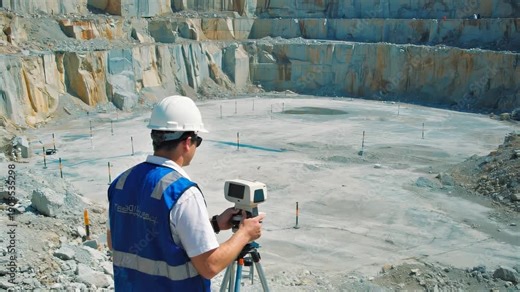 Surveyor Using Laser Scanner for Topographic Surveying on Construction Site, Geospatial Data Collection