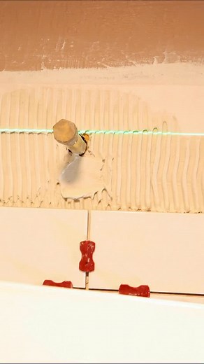 Tile shower tips for plumbing…I’m using a diamond hole saw with an attachment for drills. The template guides the hole saw and retain water, which reduces chipping. I use Perfect Level Master crosses to get consistent grout joints, they’re available in 1/32, 1/16, and 1/8 inch sizes 🔥#tileshower #bathroomremodel #homerenovation #homerepairtutor | Home Repair Tutor