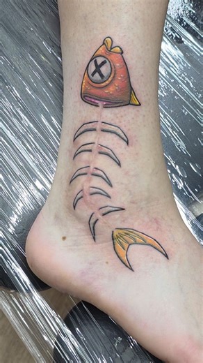 Holy Skin Tattoo Wanaka Nz on Instagram: "what do you do with a scar?? put fishstick from fortnite on it, that's what. cheers nico for the super fun idea! by resident artist Nathan @dewartattoo if you need a cheeky cover up flick us an email holyskinwanaka@gmail.com & we'll see what we can do . . #coveruptattoo #fishstick #fortnite #fortnitetattoo #wanakatattoo"