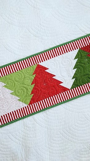 Kristina Brinkerhoff || Modern Sewing and Quilting Patterns | Putting the finishing touches on my Christmas Tree Table Runner. 🥰 All fabrics are @rileyblakedesigns basics and the digital pantograph is... | Instagram