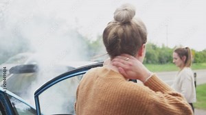 Two Female Drivers Getting Out Of Cars After Auto Accident