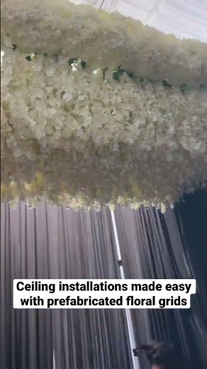 Floral ceiling installations made easy with prefabricated floral grids from Shop Forever Blooms.